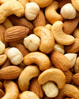 Close-up of a mix of nuts including cashews, almonds, and hazelnuts. Fancy Mixed Nuts in Singapore by Camel Nuts
