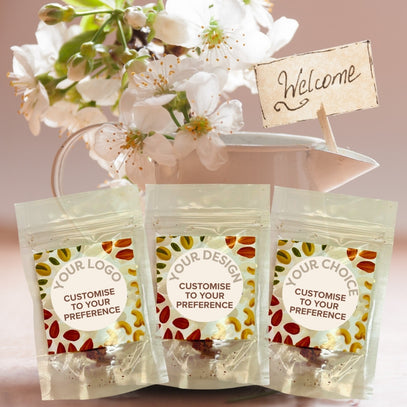 Three customizable product packages with floral background and 'Welcome' sign. Camel Nuts Singapore