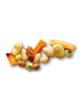 Assorted mixed snacks with prawn crackers, broadbeans, grams, peas, and peanuts on a white background