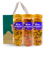Three bottles of Camel Muruku festive bundle come with paper bag as seen in the background