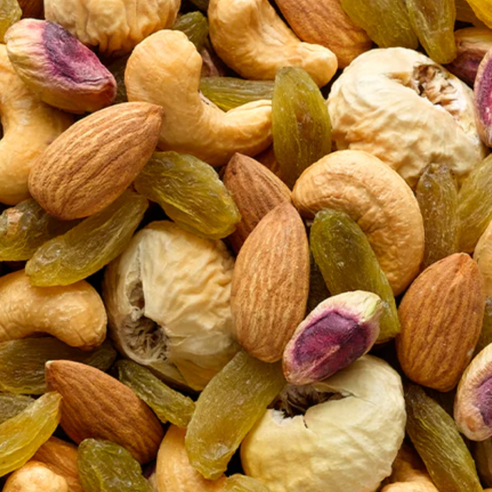 Assorted nuts and dried fruits including almonds, raisins, and cashews. Find the best nuts in Singapore at Camel Nuts
