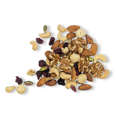 Assorted nuts and dried fruits on a white background. Camel Nuts Singapore