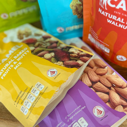 Assorted packages of nuts and dried fruits  by Camel Nuts Singapore