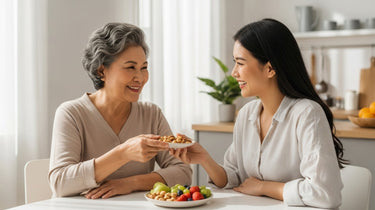 Camel Nuts Singapore mindful eating together – Two women enjoying nuts and fruit while sharing a plate.