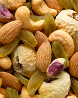 Assorted nuts and dried fruits including almonds, raisins, and cashews. Find the best nuts in Singapore at Camel Nuts