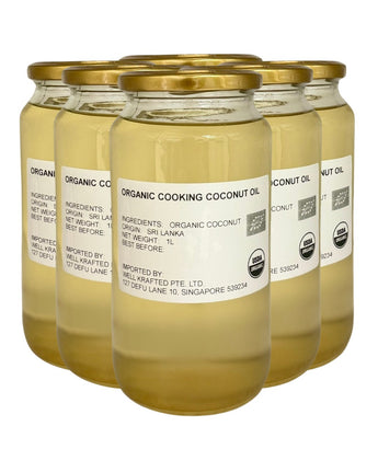 Camel Nuts jars of organic cooking coconut oil with gold lids.