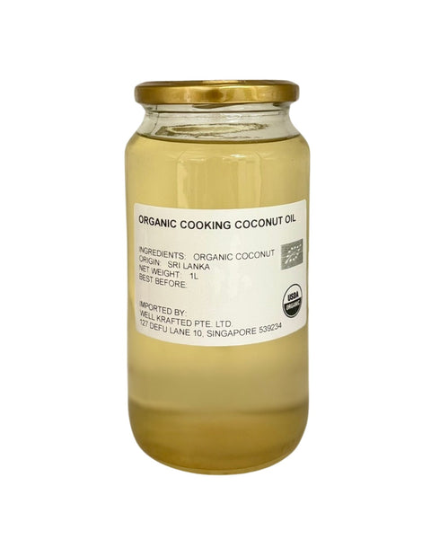 Jar of Camel Nuts' organic cooking coconut oil with a gold lid